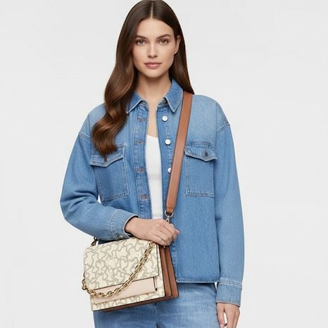 Bandolera Tous mediana Audree Kaos Icon cadena dorada Monograma claro Vainilla con rosa