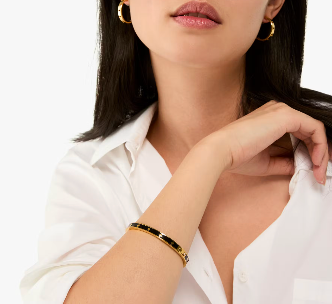 Pulsera Kate Spade negra con dorado