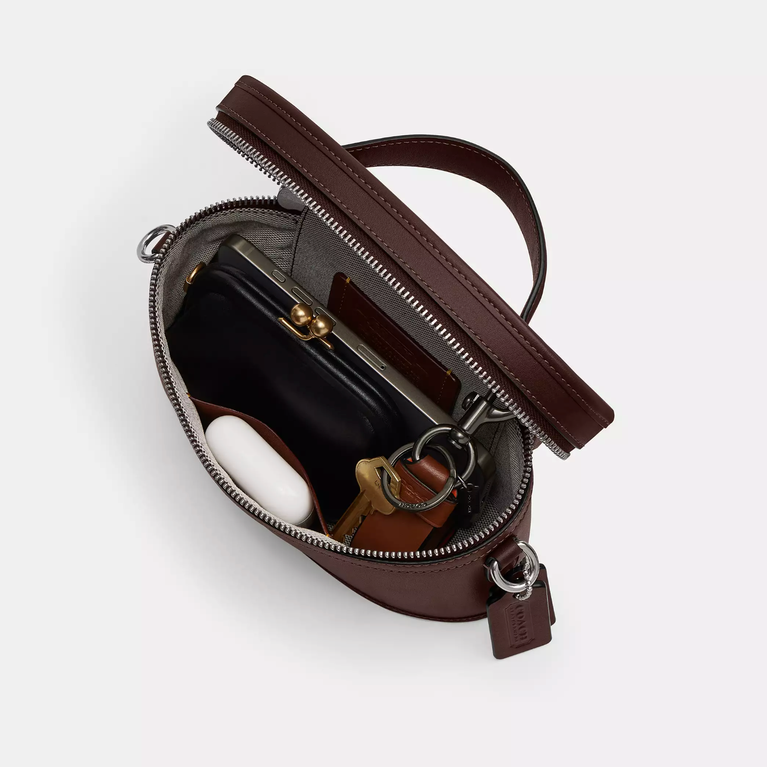 Cartera Coach Trail Bag café