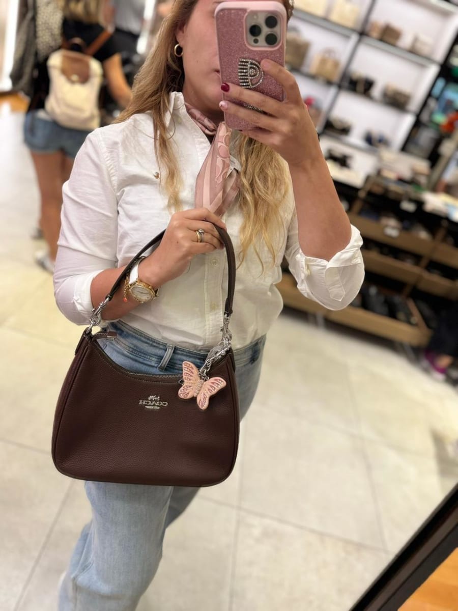 Llavero Coach Mariposa Rosada