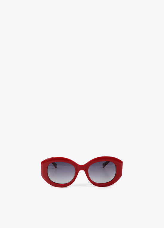 Lentes Lola Casademunt  de sol en forma redondeada con logo leopardo rojo
