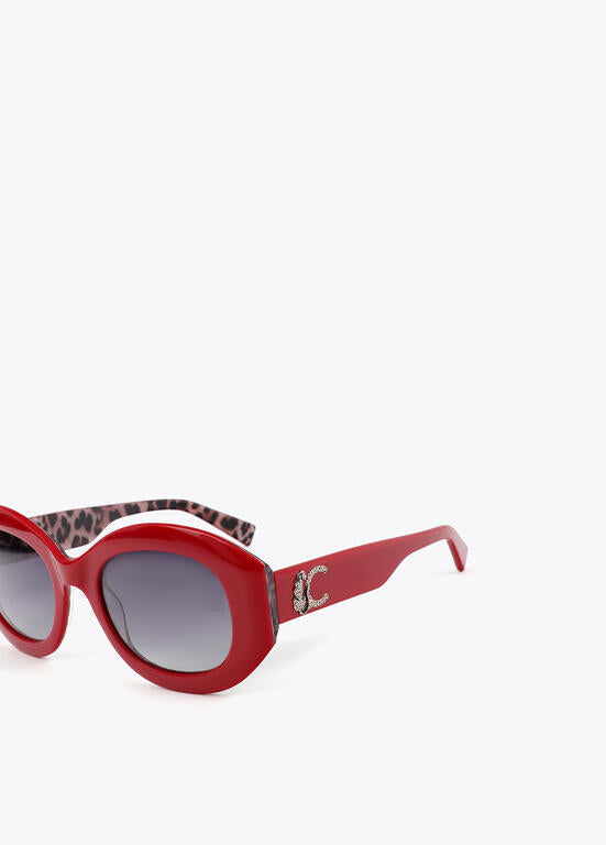 Lentes Lola Casademunt  de sol en forma redondeada con logo leopardo rojo