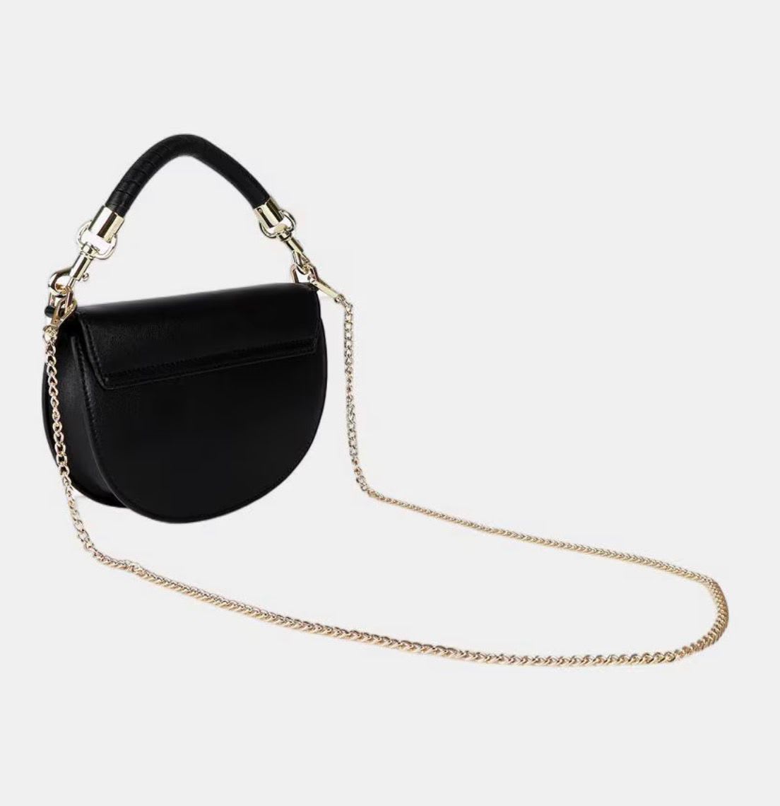 Cartera Lola Casademunt media luna con solapa y asa trenzada negro